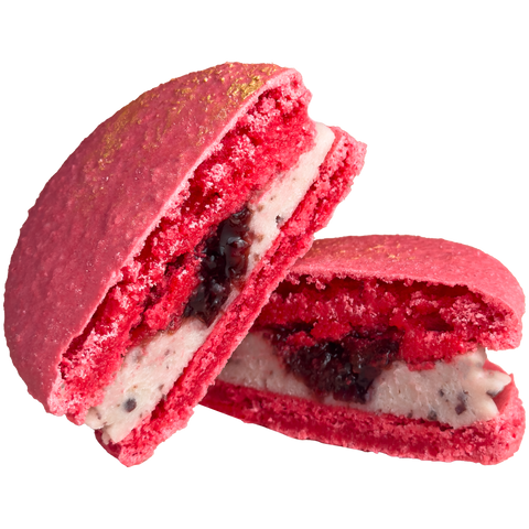 Two red macarons with a white filling and dark filling on a white background