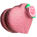 Pink macaron with a pink rose on a white background